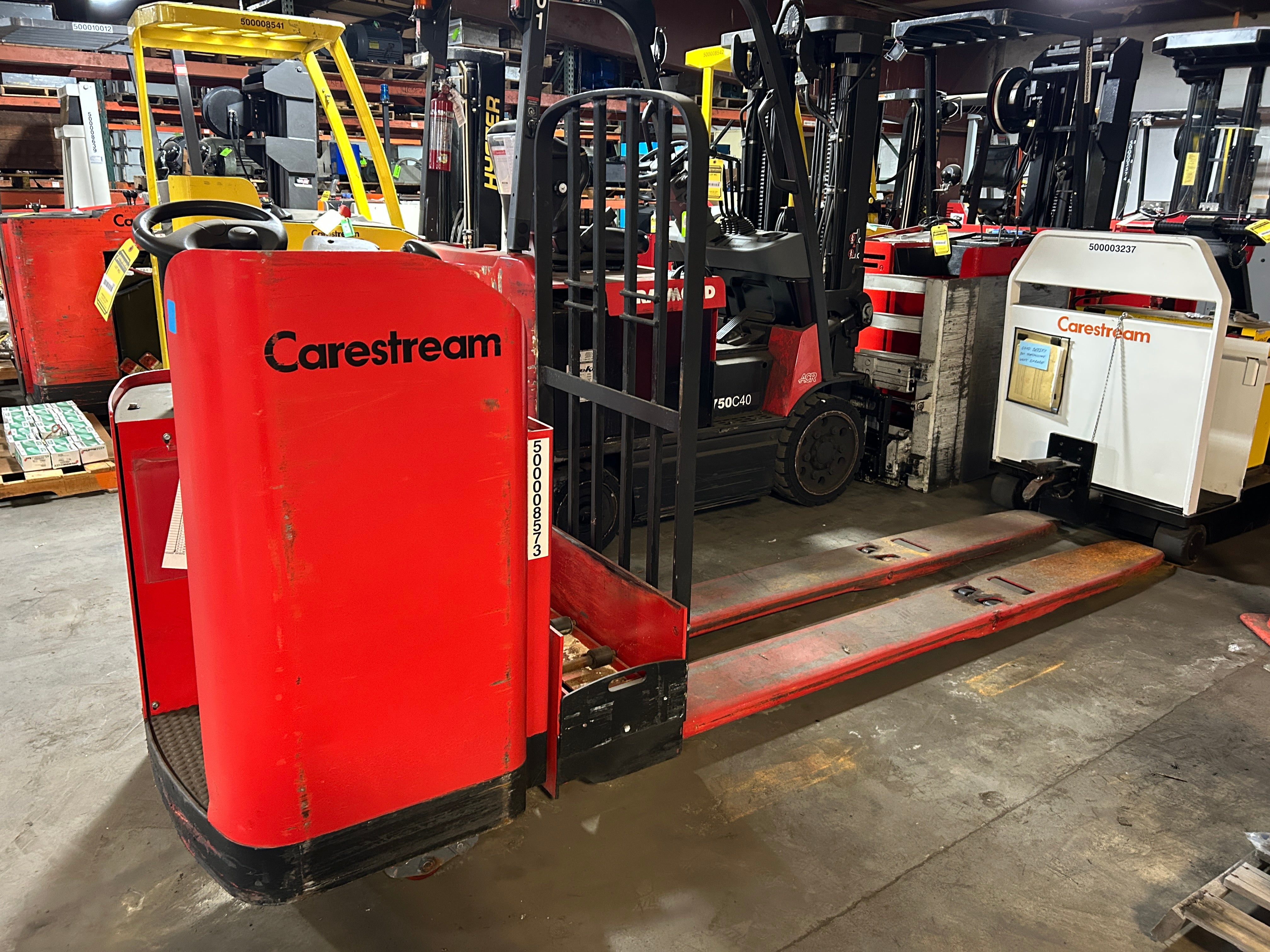 Raymond 19-F80L Electric Pallet Jack Stand-Up Rider Long Forks 8000 Lb. 24V